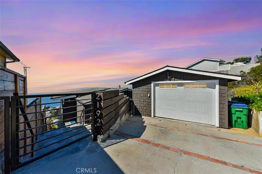 2192 Crestview Drive Laguna Beach, CA 92651 - Photo 50 of 54 a front view of a house with a garage