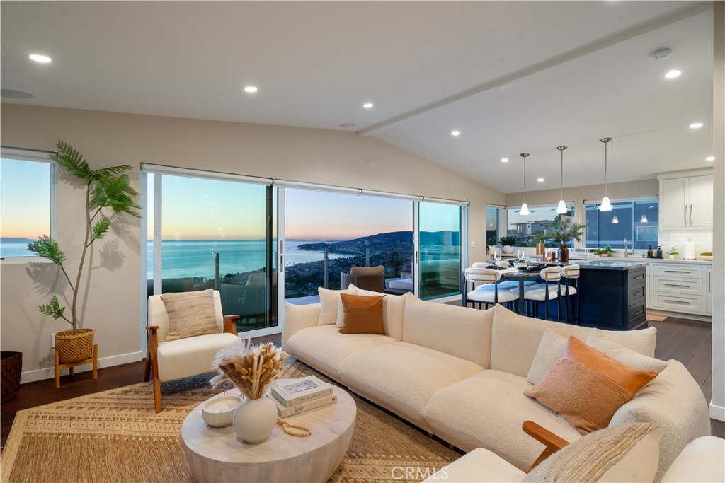 2192 Crestview Drive Laguna Beach, CA 92651 - Photo 6 of 54 a living room with furniture and a large window