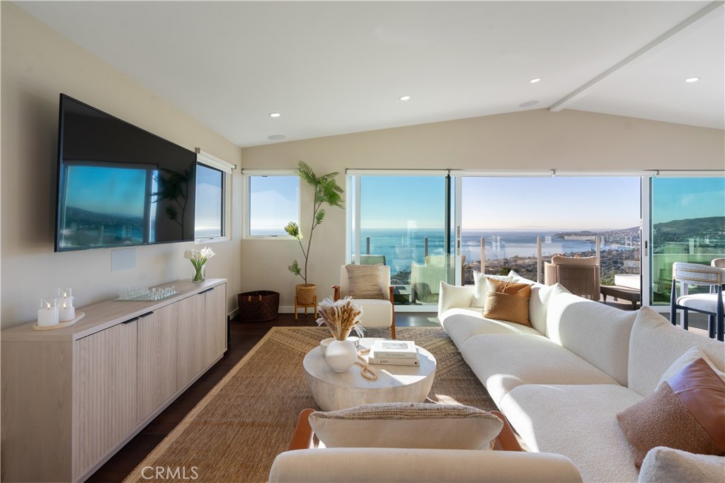 2192 Crestview Drive Laguna Beach, CA 92651 - Photo 7 of 54 a living room with furniture and a flat screen tv