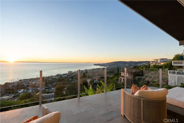 a view of a balcony with an ocean view