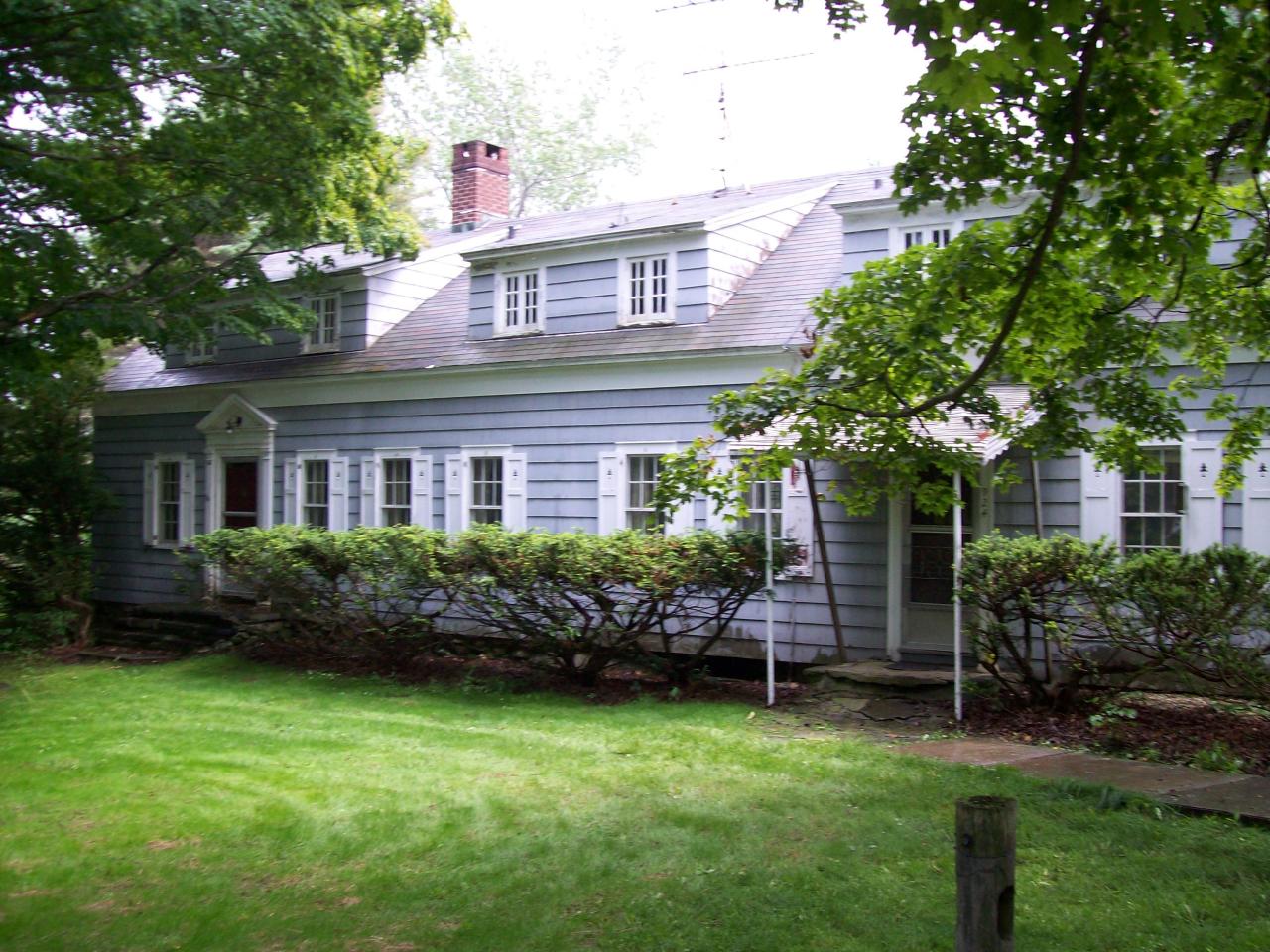 924 East Windsor Road Windsor, MA 01270 - Photo 1 of 2 a front view of a house with a garden
