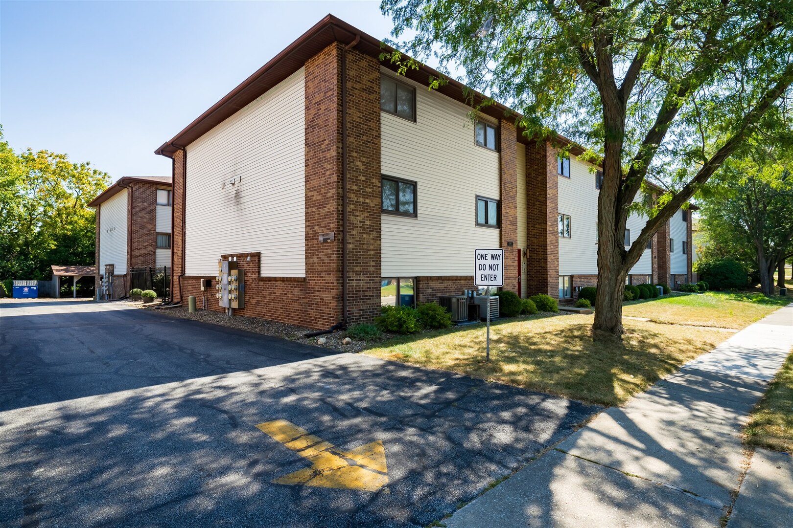 1916 Tracy Drive, Unit 26 Bloomington, IL 61704 - Photo 2 of 23 a view of a house with a yard
