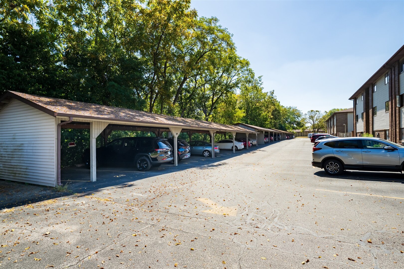 1916 Tracy Drive, Unit 26 Bloomington, IL 61704 - Photo 23 of 23 a view of a car in front of house