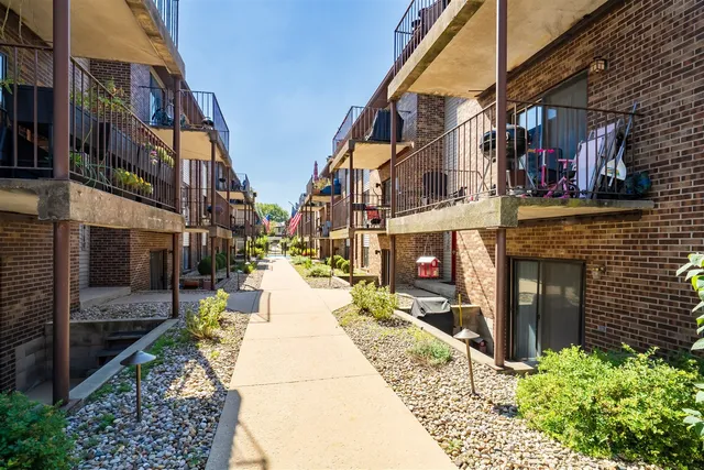 a view of a park with swings and slides