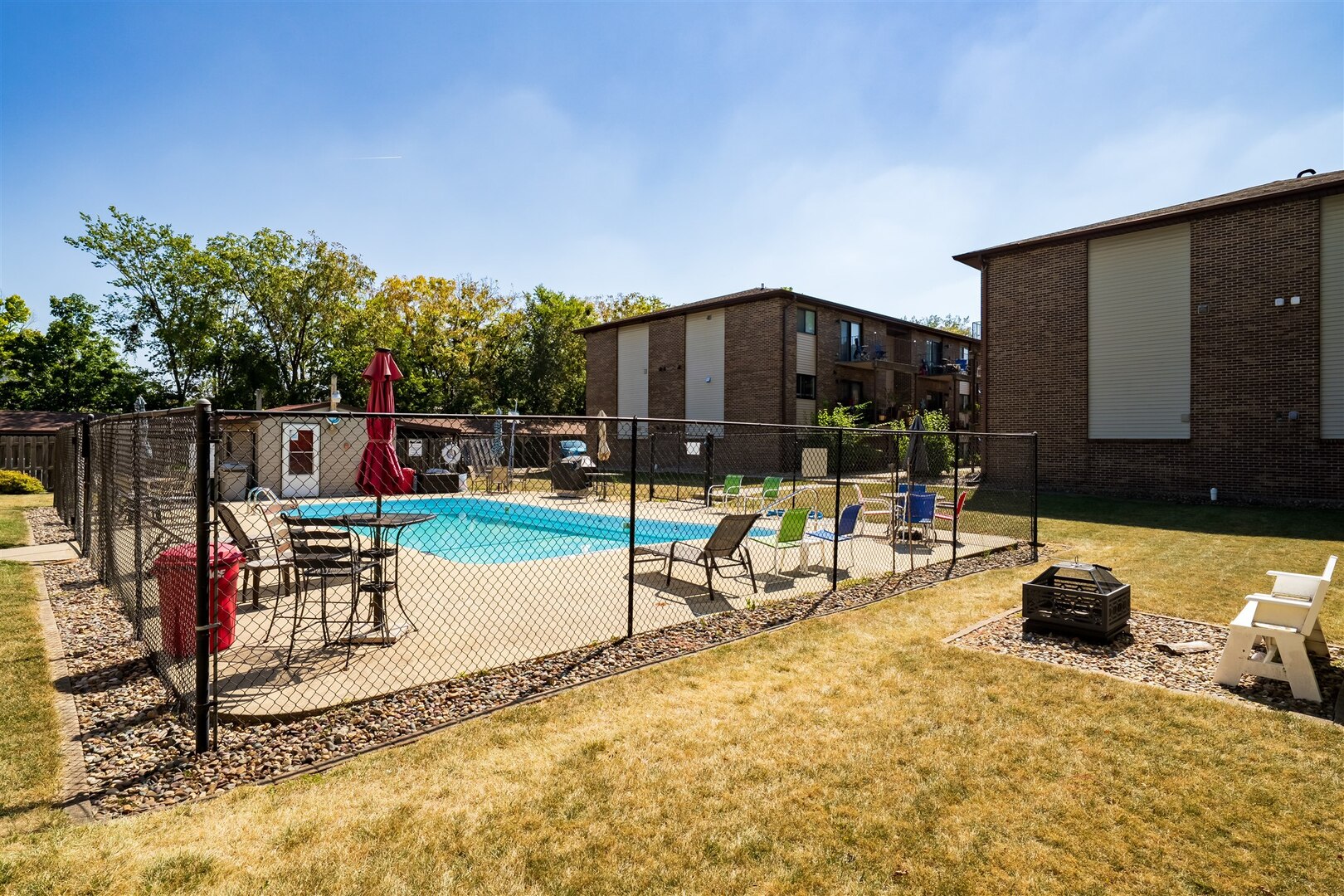 1916 Tracy Drive, Unit 26 Bloomington, IL 61704 - Photo 4 of 23 a view of a park with swings and slides