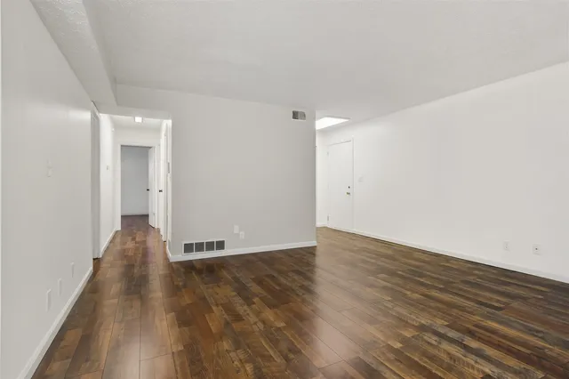 a kitchen with a refrigerator sink and cabinets