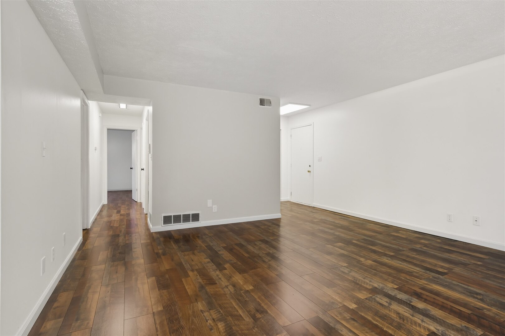 1916 Tracy Drive, Unit 26 Bloomington, IL 61704 - Photo 9 of 23 a view of a room with wooden floor and a window