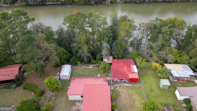 an aerial view of residential house with outdoor space and lake view