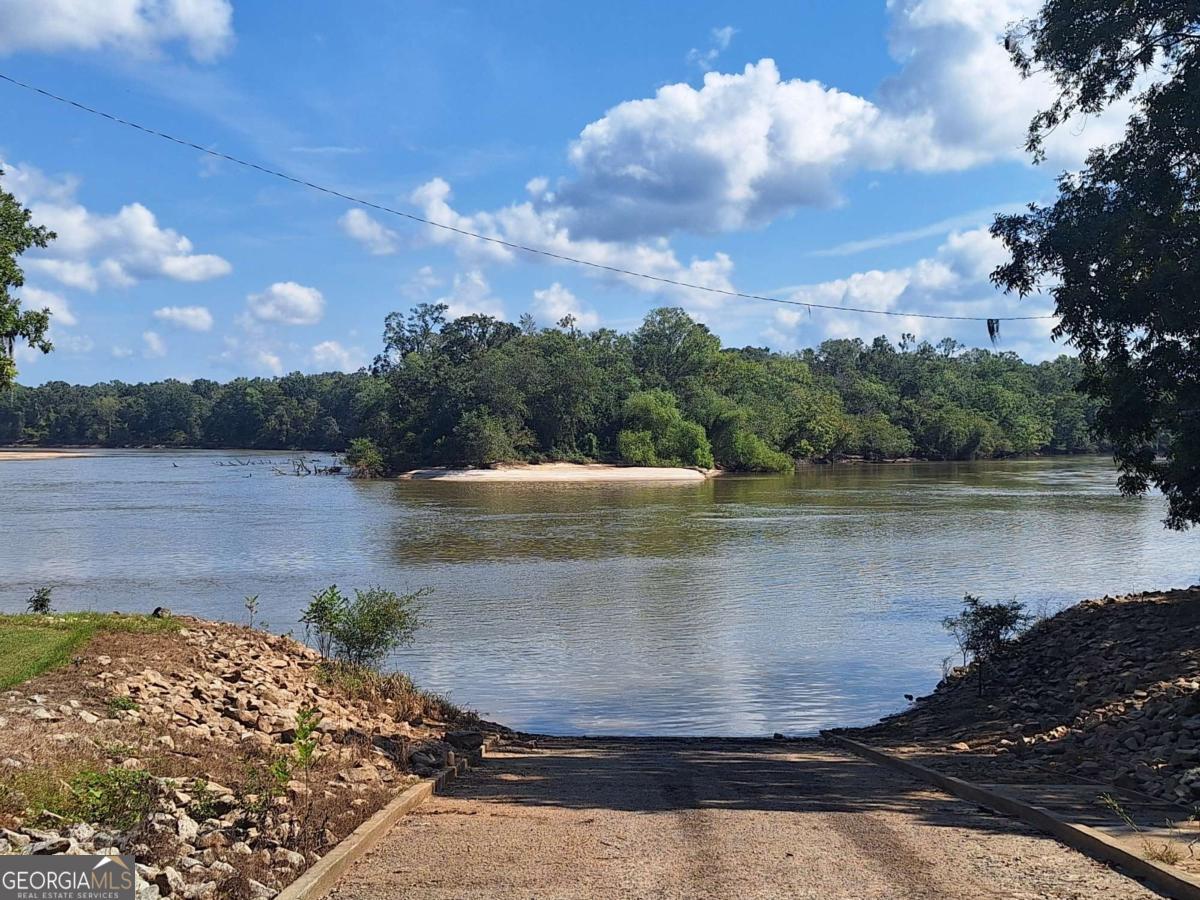 163 High Bluff Road Baxley, GA 31513 - Photo 35 of 52 a view of a lake from a yard