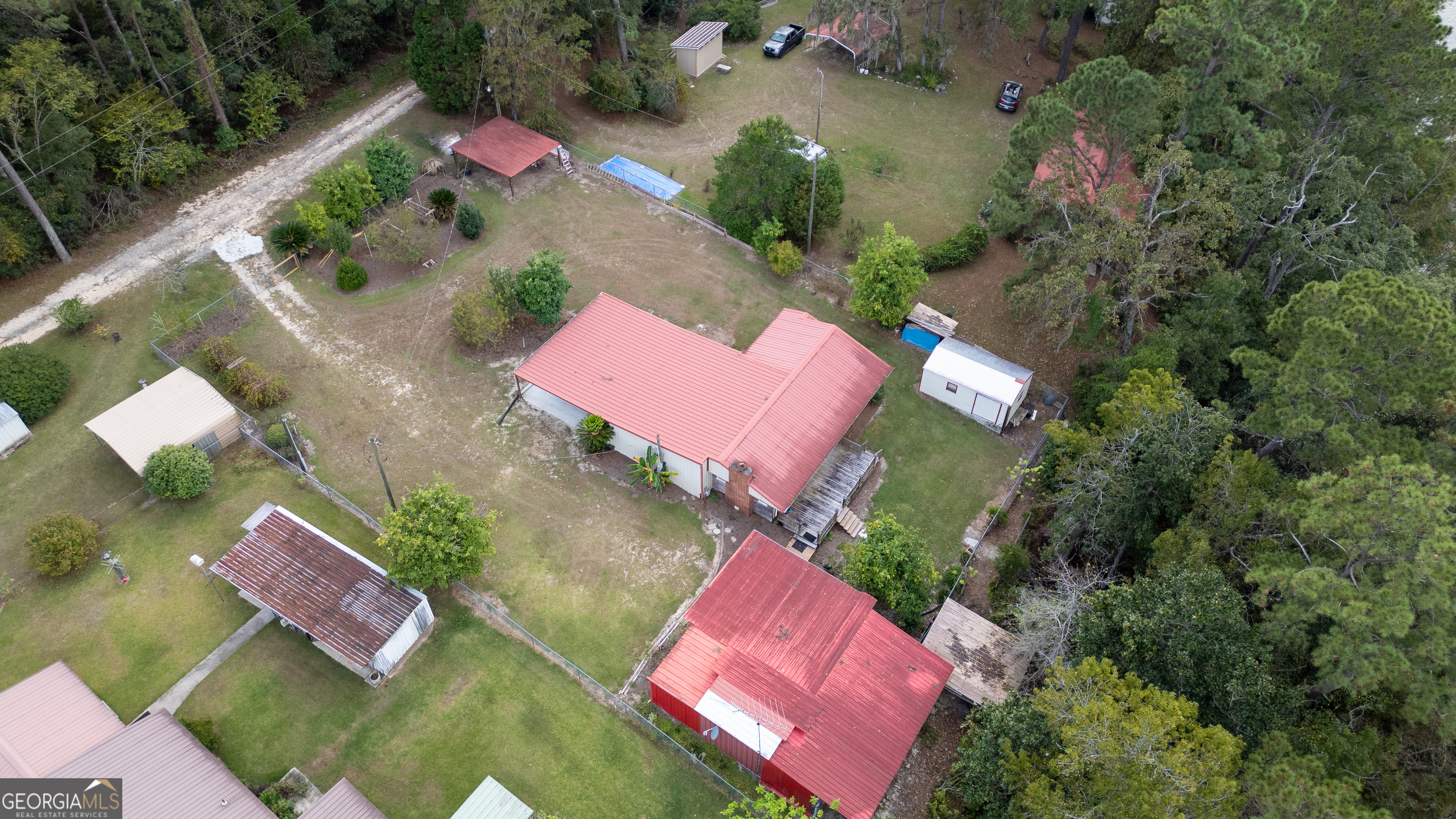 163 High Bluff Road Baxley, GA 31513 - Photo 49 of 52 an aerial view of a house with swimming pool
