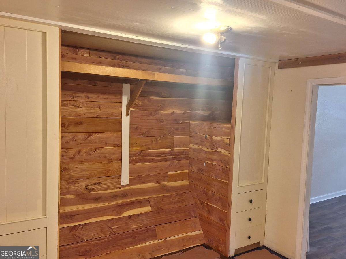 163 High Bluff Road Baxley, GA 31513 - Photo 8 of 52 a bathroom with a glass shower door