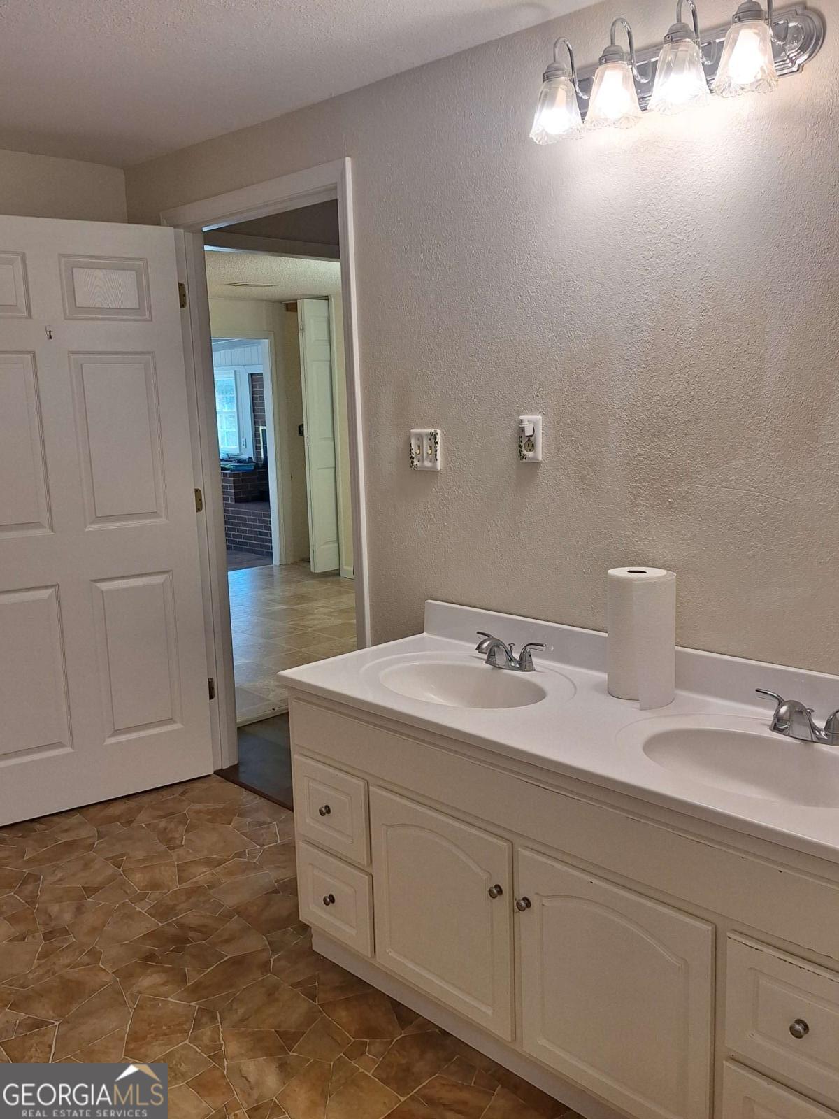 163 High Bluff Road Baxley, GA 31513 - Photo 10 of 52 a bathroom with a sink and a mirror