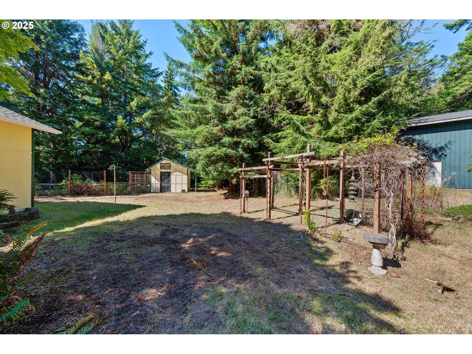 64662 East Bay Road North Bend, OR 97459 - Photo 12 of 48 a view of a house with backyard and sitting area