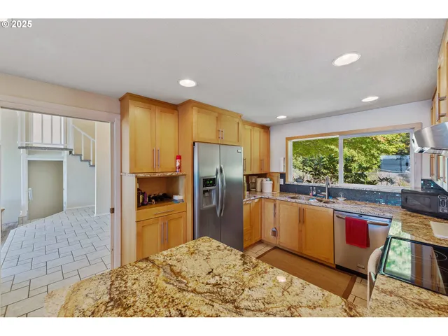a bathroom with a sink a stove and a cabinets