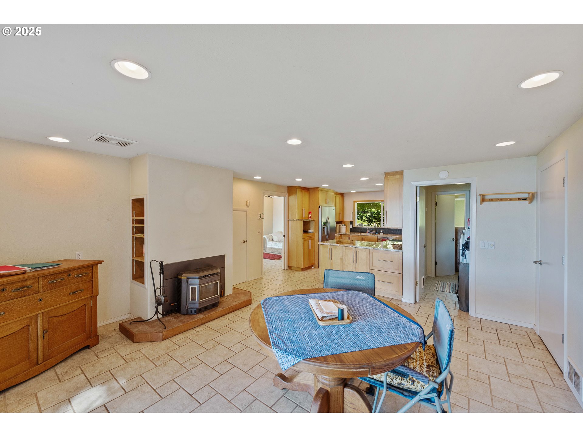 64662 East Bay Road North Bend, OR 97459 - Photo 21 of 48 a living room with furniture and a fireplace