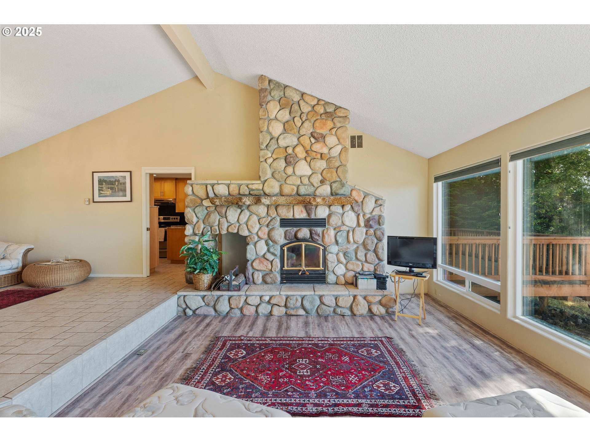 64662 East Bay Road North Bend, OR 97459 - Photo 26 of 48 a living room with furniture and a fireplace