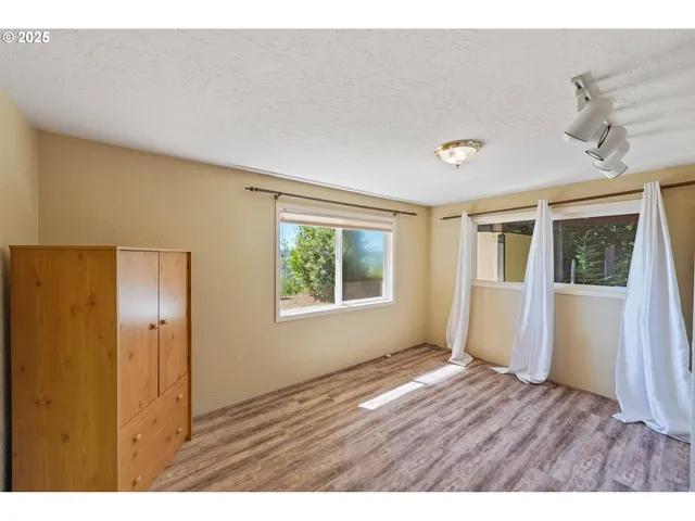 a bathroom with a sink a mirror and a shower