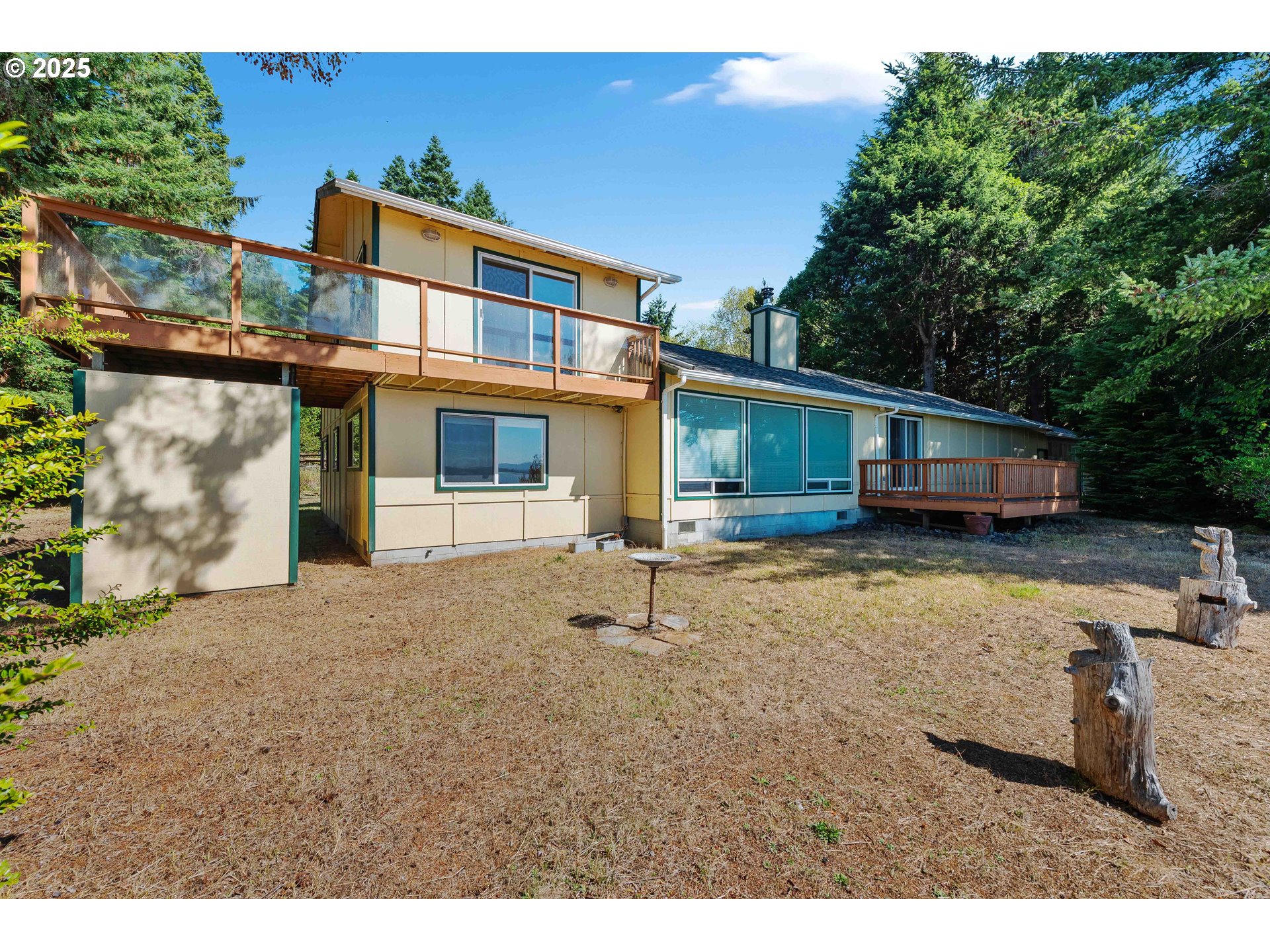 64662 East Bay Road North Bend, OR 97459 - Photo 3 of 48 a house view with a backyard space