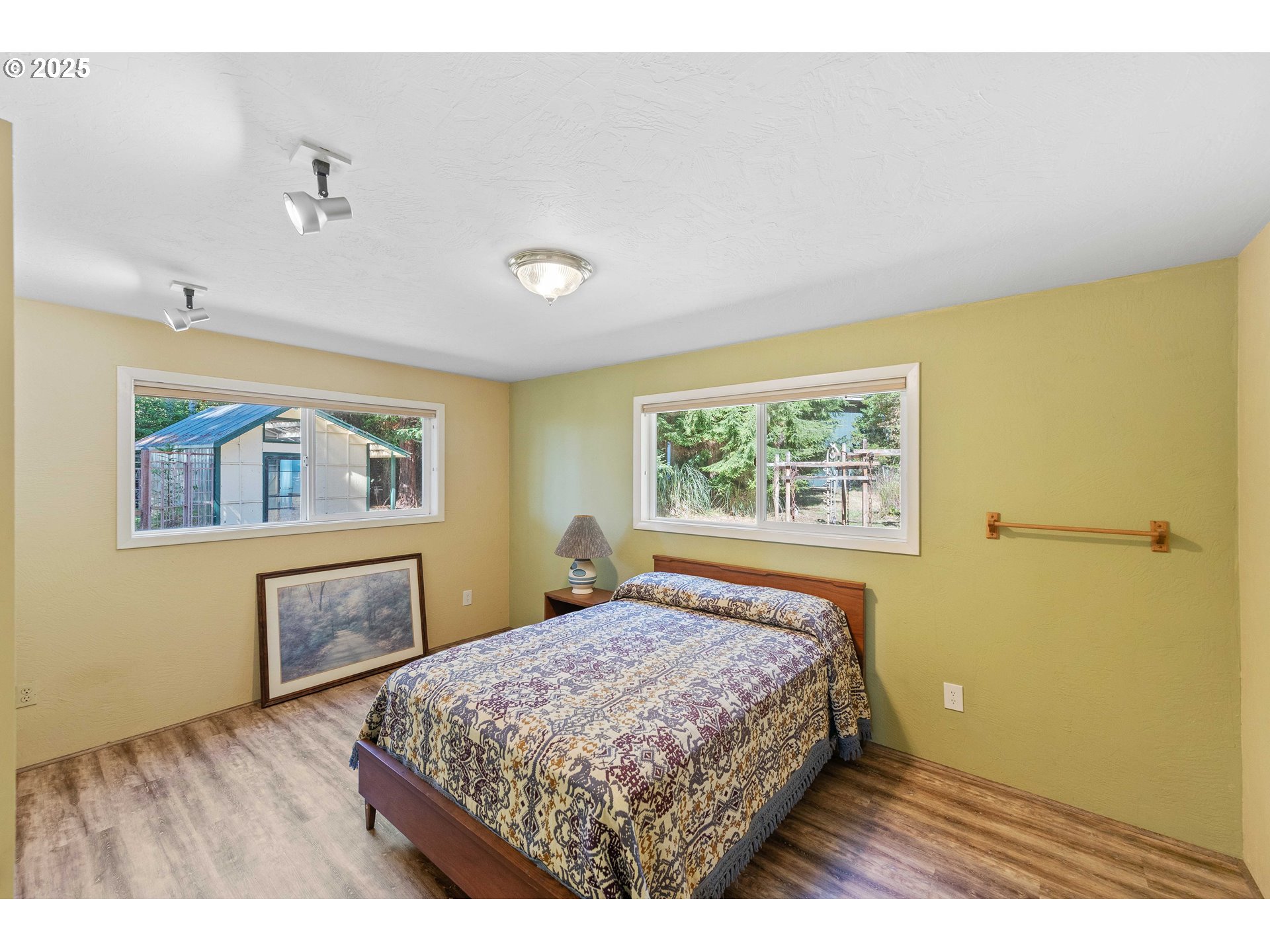 64662 East Bay Road North Bend, OR 97459 - Photo 34 of 48 a bedroom with a bed and a window