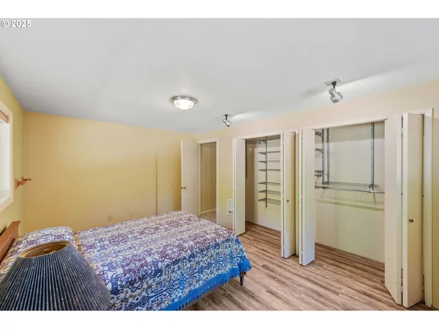 a bedroom with a bed and a night stand