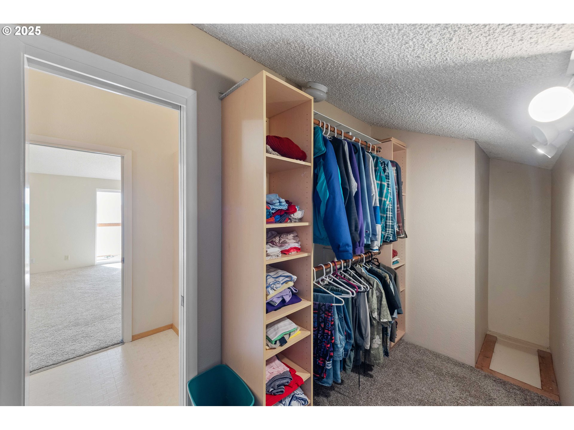 64662 East Bay Road North Bend, OR 97459 - Photo 41 of 48 a view of walk in closet with clothes and shoes