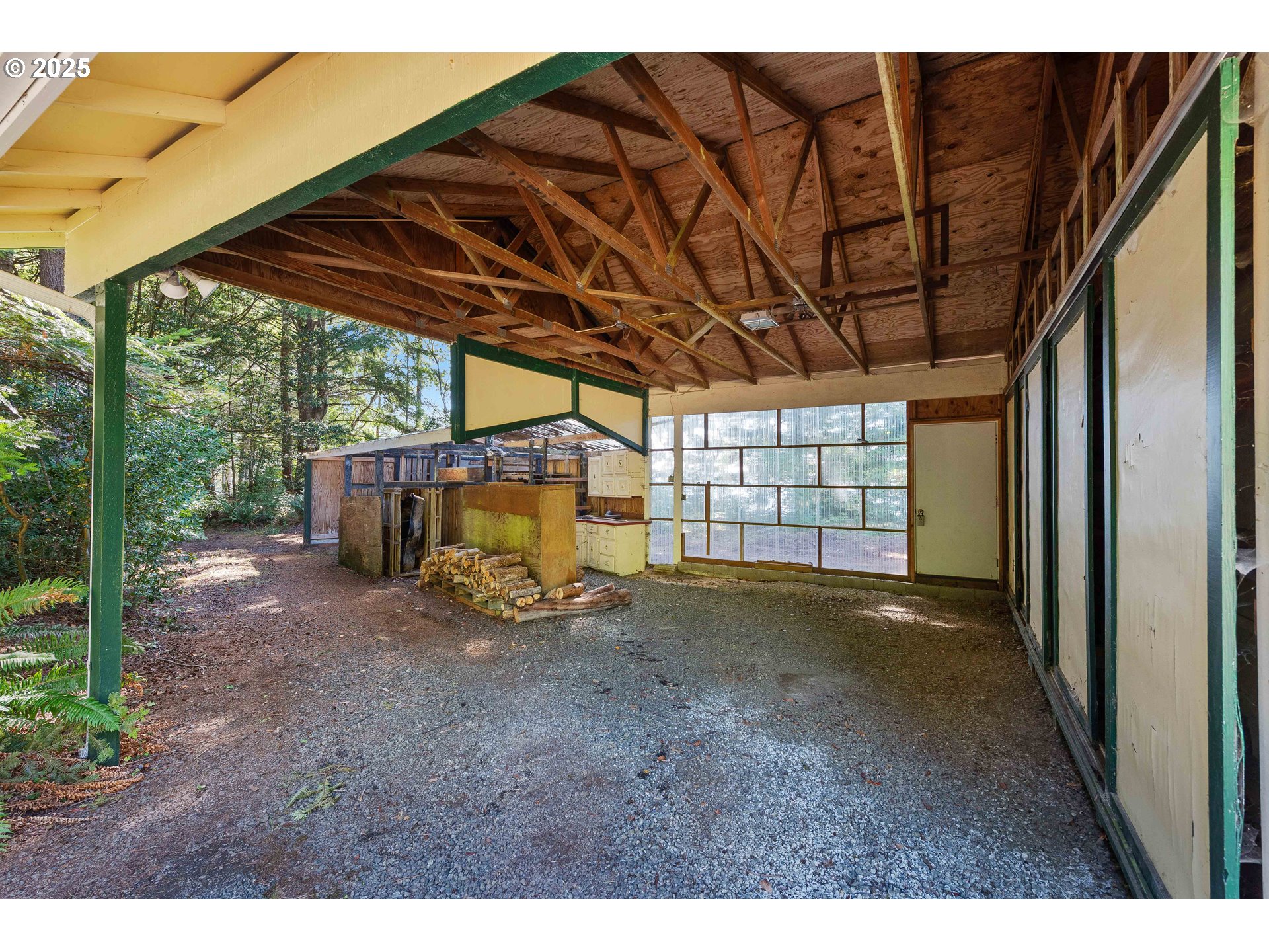 64662 East Bay Road North Bend, OR 97459 - Photo 10 of 48 a view of a room with wooden walls and roof