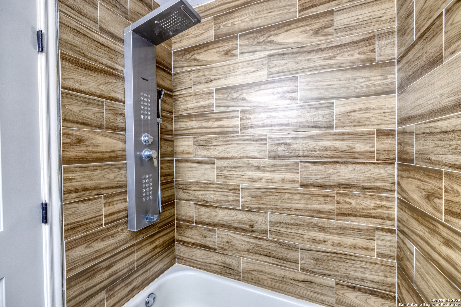 703 North 3rd Street Carrizo Springs, TX 78834 - Photo 14 of 24 a bathroom with a shower