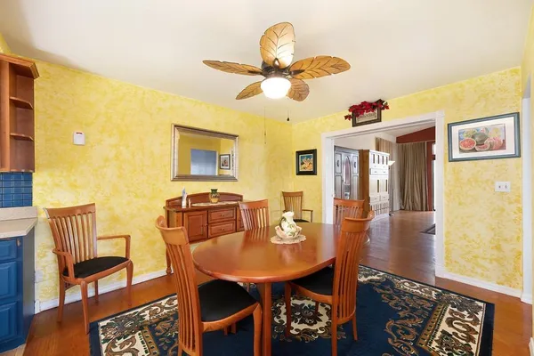 a dining room with furniture and window