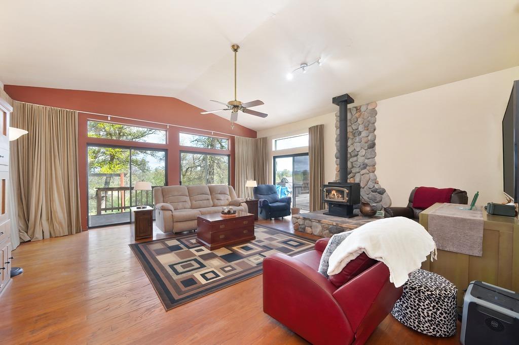 6930 Loggers Hollow Road Somerset, CA 95684 - Photo 14 of 42 a living room with furniture and a large window