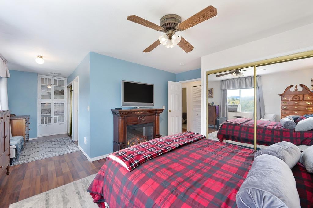 6930 Loggers Hollow Road Somerset, CA 95684 - Photo 21 of 42 a bedroom with a bed and a flat screen tv