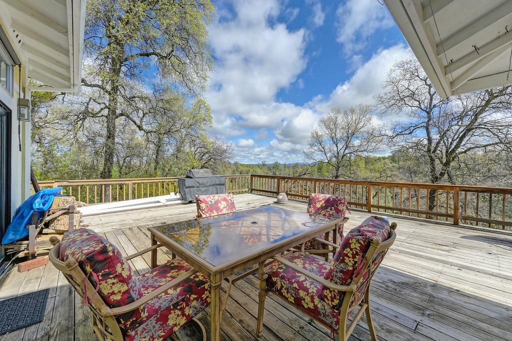 6930 Loggers Hollow Road Somerset, CA 95684 - Photo 28 of 42 a view of a roof deck with furniture