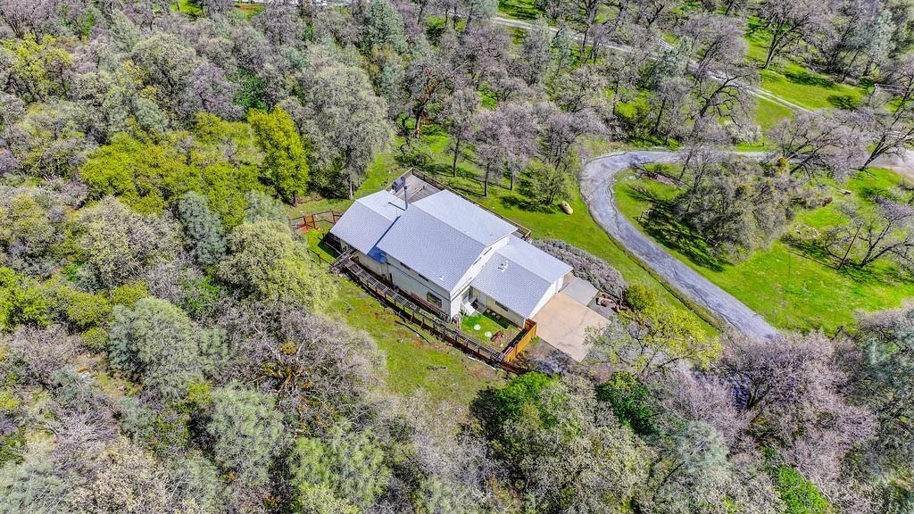 6930 Loggers Hollow Road Somerset, CA 95684 - Photo 32 of 42 an aerial view of a house with a yard and swimming pool