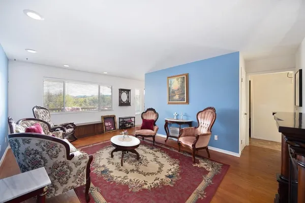 a living room with furniture and a rug