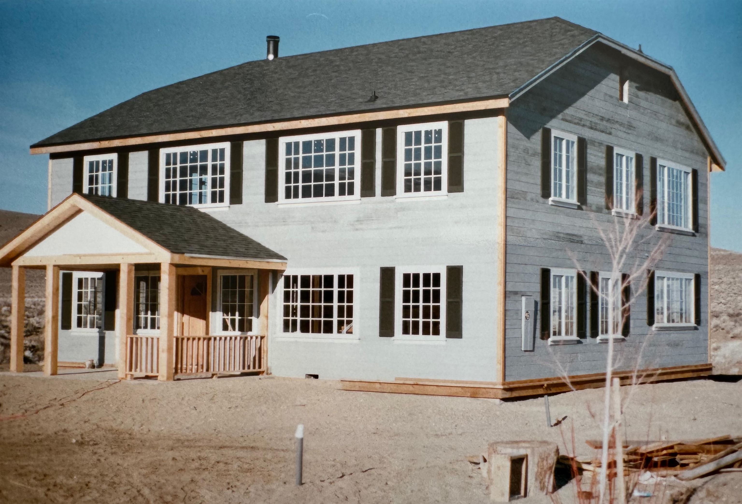 416 Wilson Creek Road Lee Vining, CA 93541 - Photo 52 of 64 a front view of a house with large windows