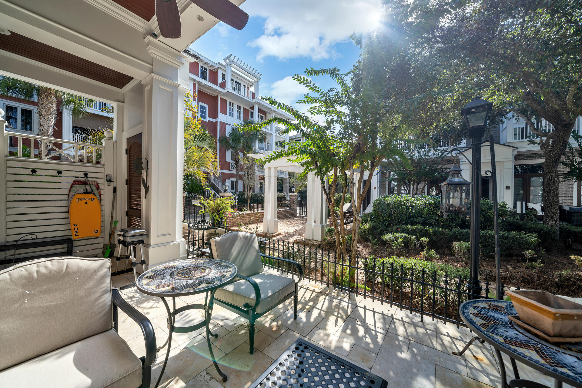 9201 Market Street Inn, Unit 162 Miramar Beach, FL 32550 - Photo 13 of 67 a view of a patio with couches table and chairs and potted plants