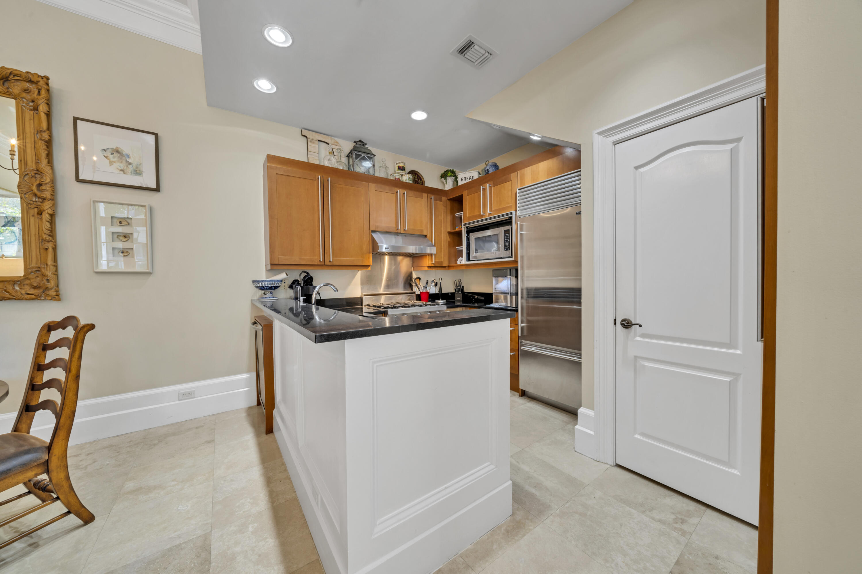 9201 Market Street Inn, Unit 162 Miramar Beach, FL 32550 - Photo 2 of 67 a kitchen with stainless steel appliances granite countertop a refrigerator and a stove top oven