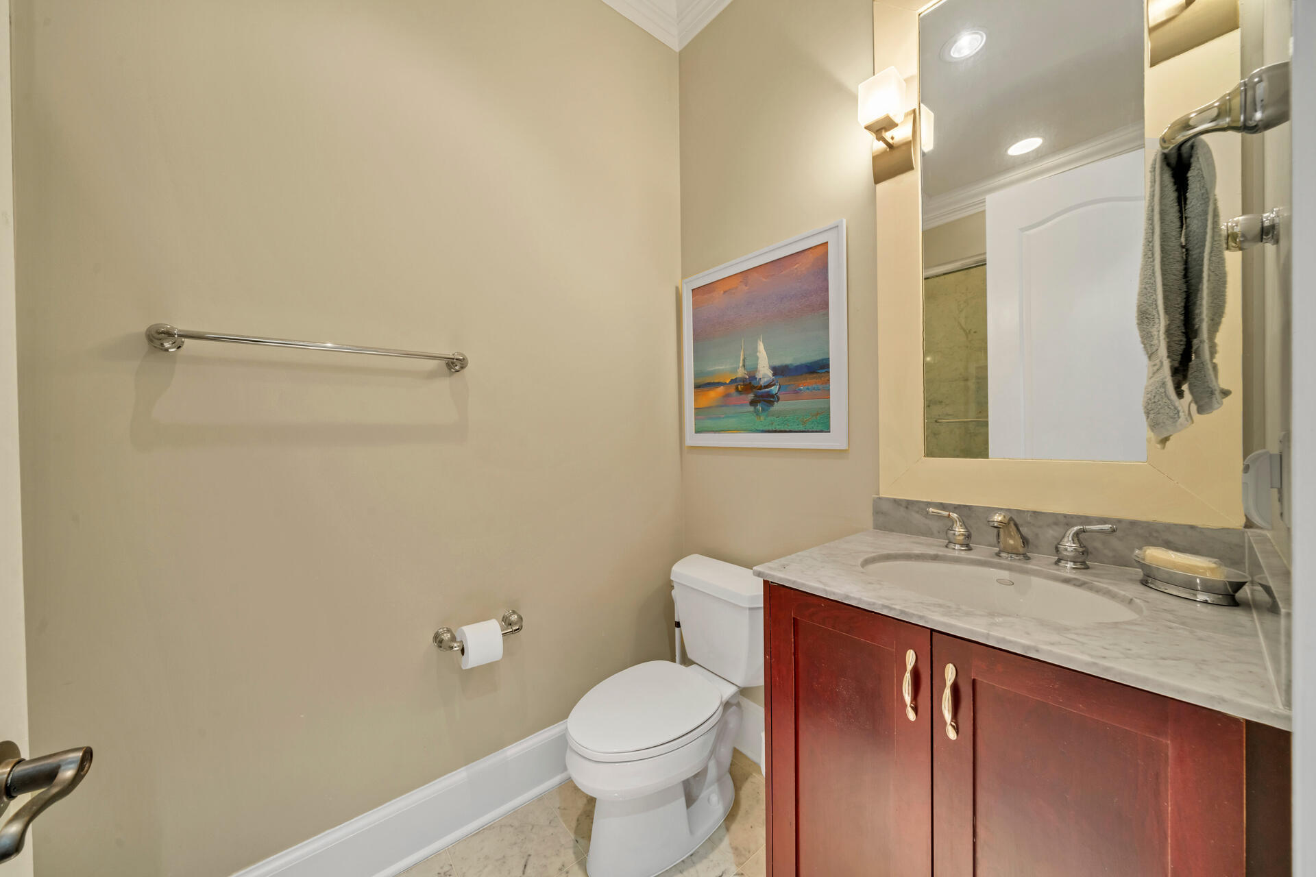 9201 Market Street Inn, Unit 162 Miramar Beach, FL 32550 - Photo 32 of 67 a bathroom with a granite countertop toilet sink and mirror