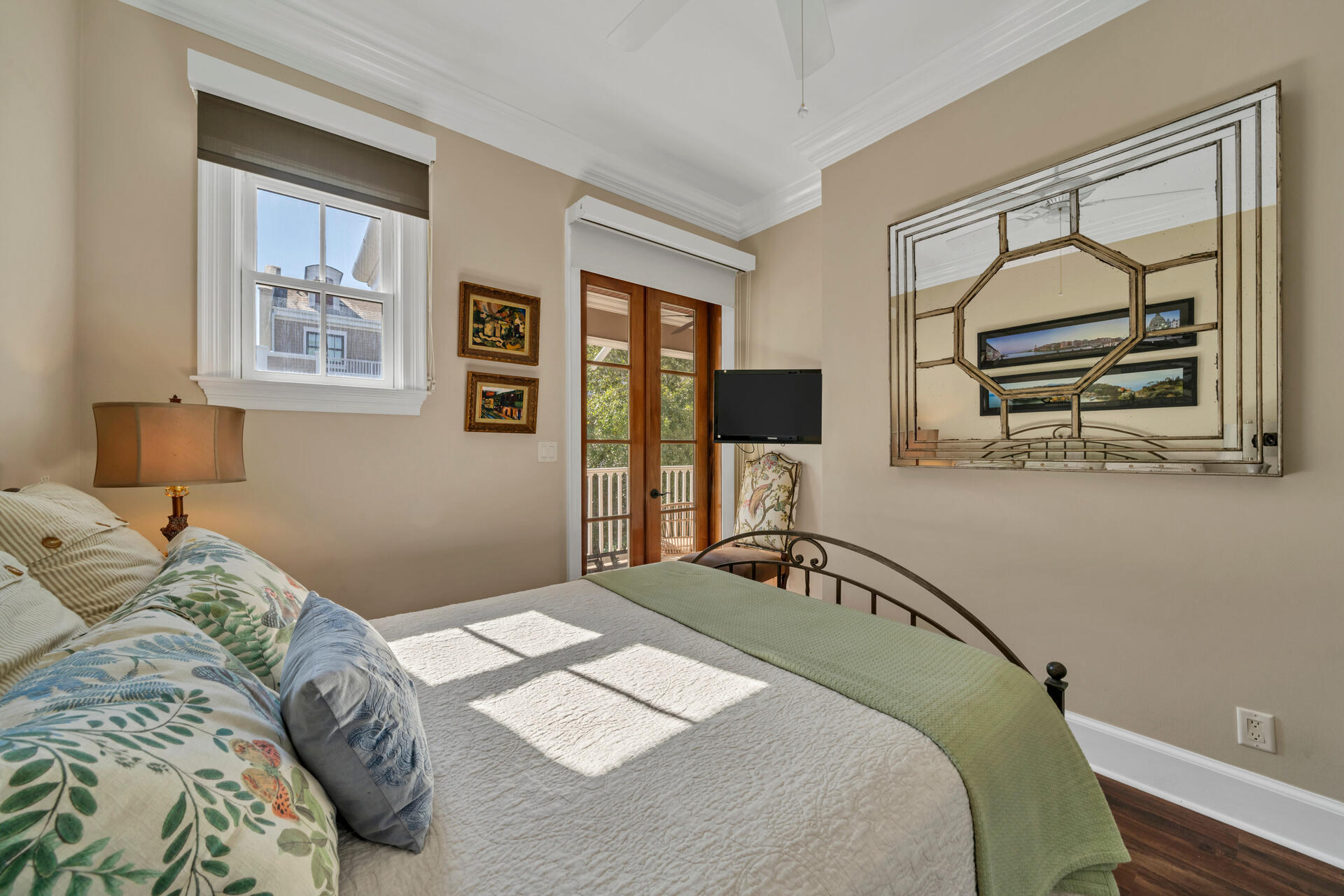 9201 Market Street Inn, Unit 162 Miramar Beach, FL 32550 - Photo 35 of 67 a bedroom with a bed and wooden floor