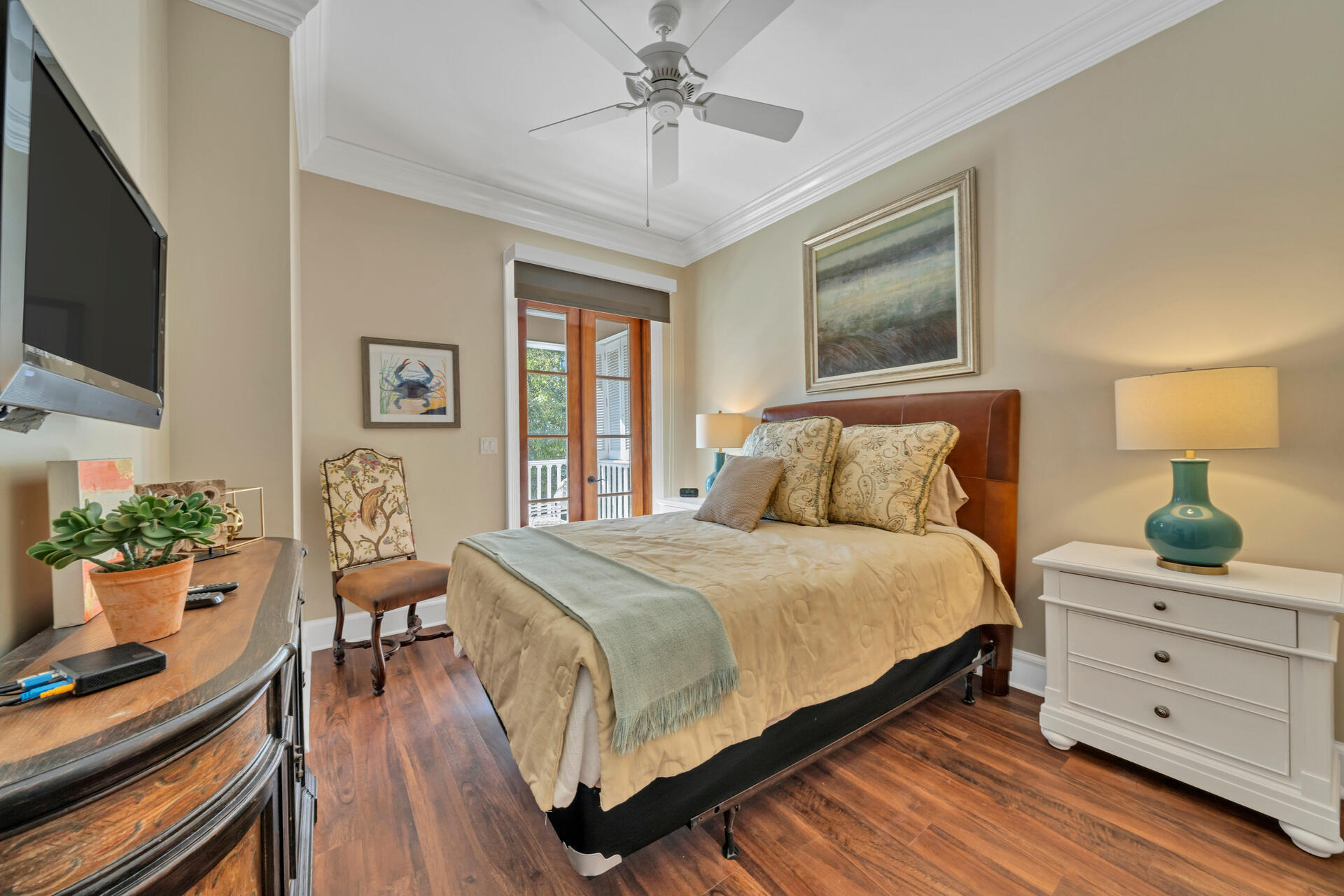 9201 Market Street Inn, Unit 162 Miramar Beach, FL 32550 - Photo 36 of 67 a bedroom with a large bed and a flat tv screen on dresser