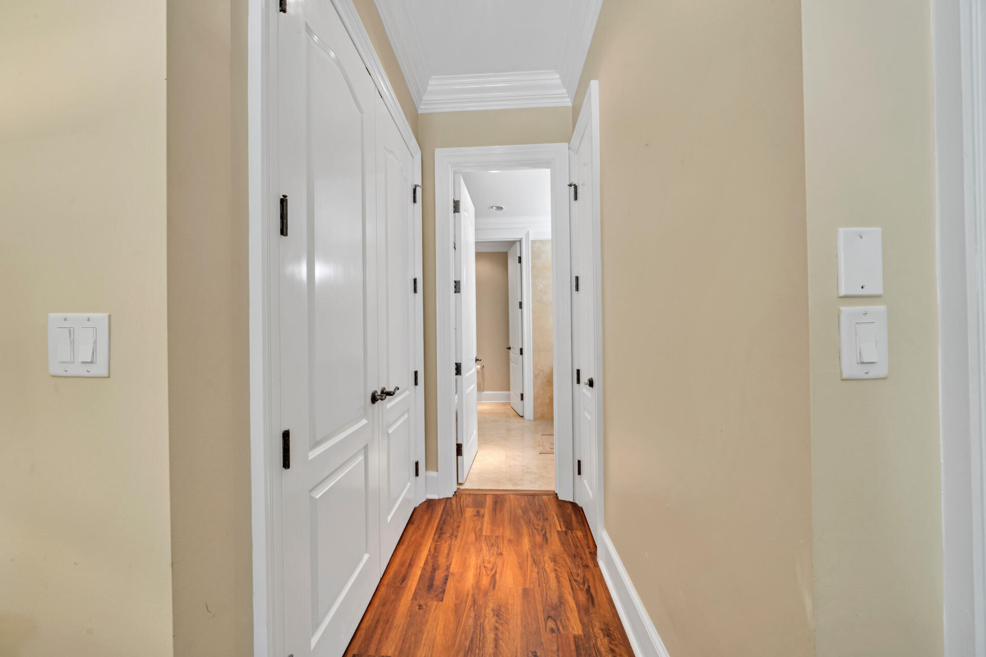9201 Market Street Inn, Unit 162 Miramar Beach, FL 32550 - Photo 38 of 67 a view of a hallway with wooden floor and a bathroom