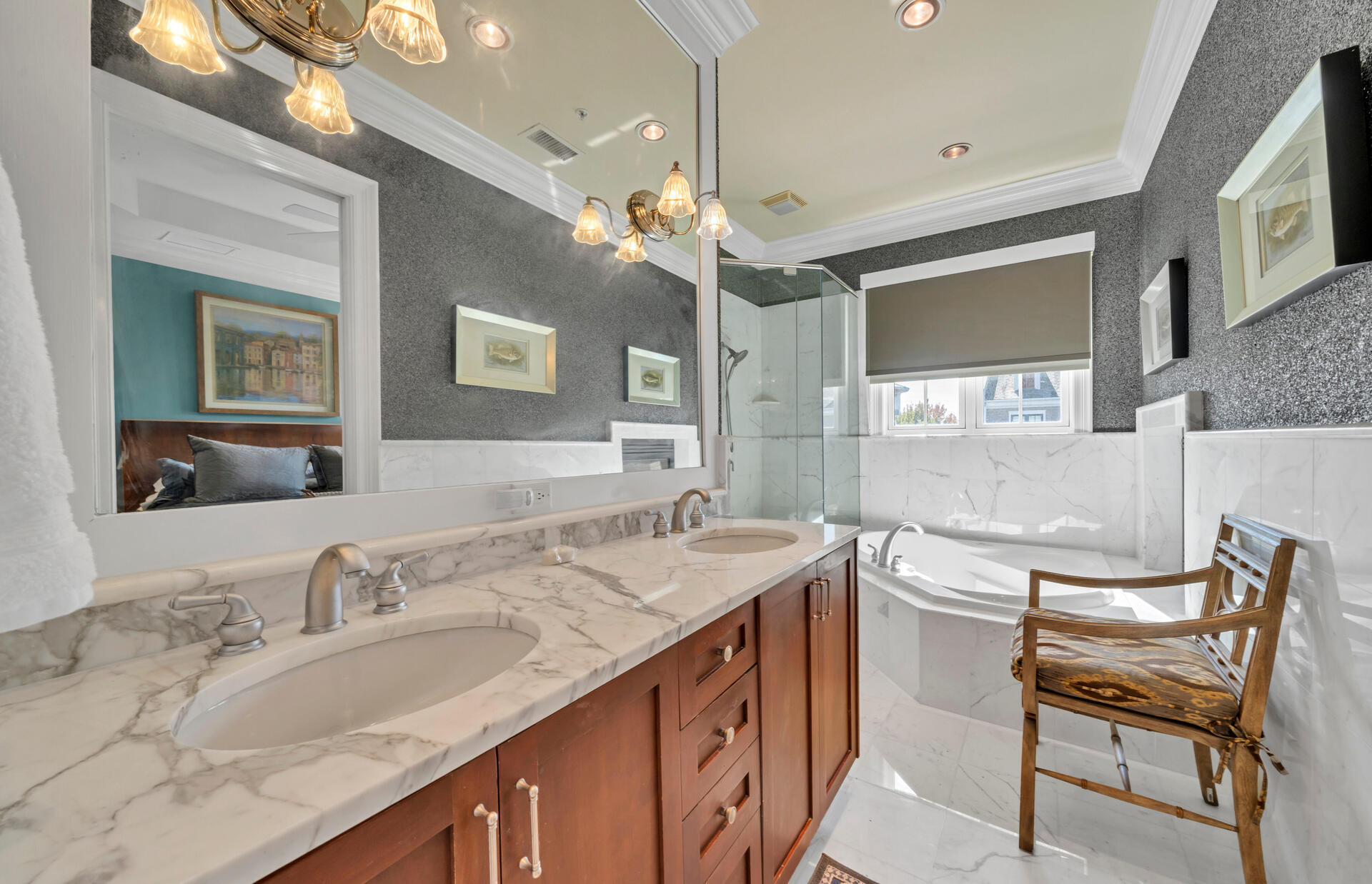 9201 Market Street Inn, Unit 162 Miramar Beach, FL 32550 - Photo 43 of 67 a bathroom with a granite countertop sink a large mirror and a bathtub