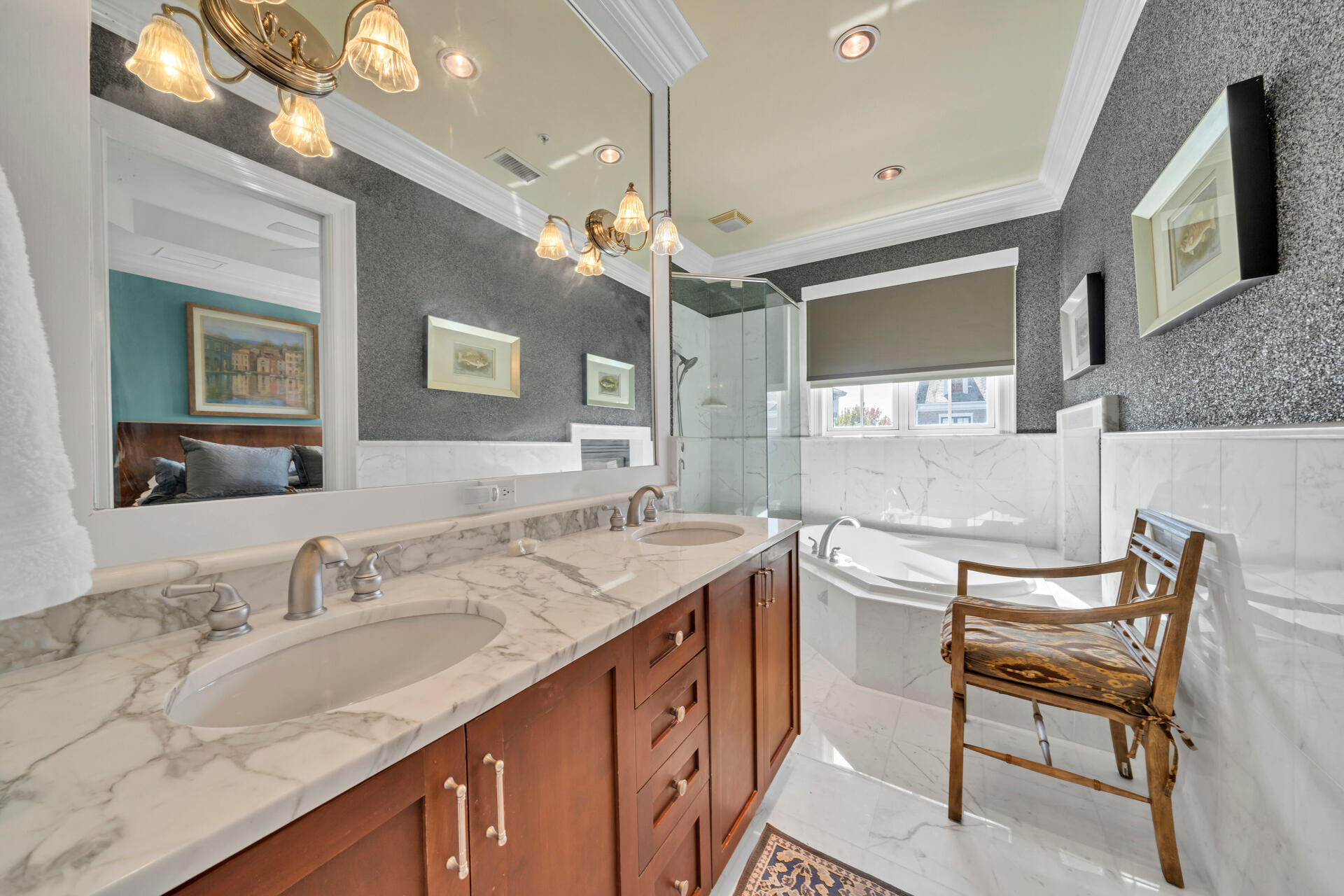 9201 Market Street Inn, Unit 162 Miramar Beach, FL 32550 - Photo 44 of 67 a spacious bathroom with a granite countertop sink a large mirror and a bathtub