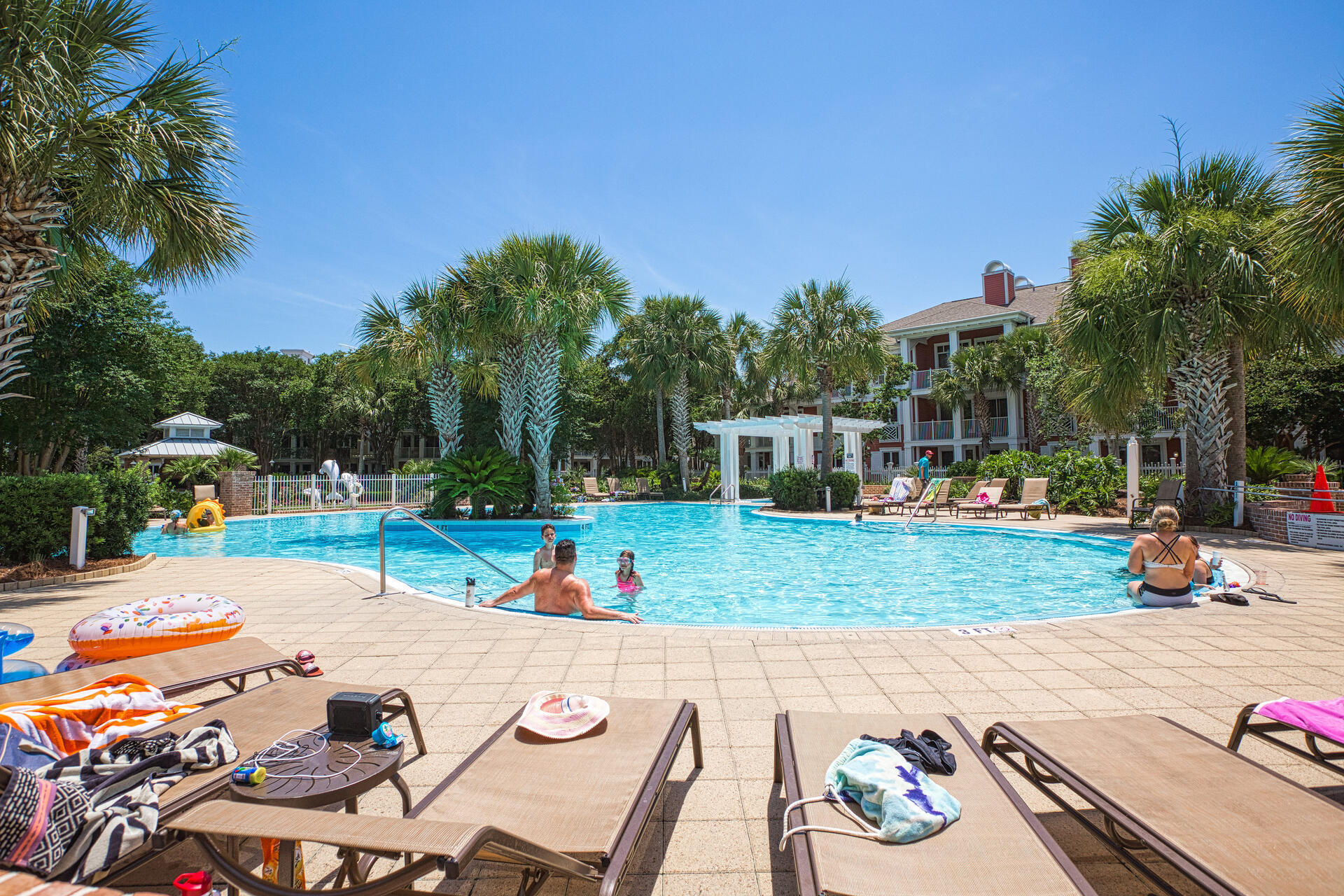9201 Market Street Inn, Unit 162 Miramar Beach, FL 32550 - Photo 56 of 67 a view of a patio with a table and chairs under an umbrella