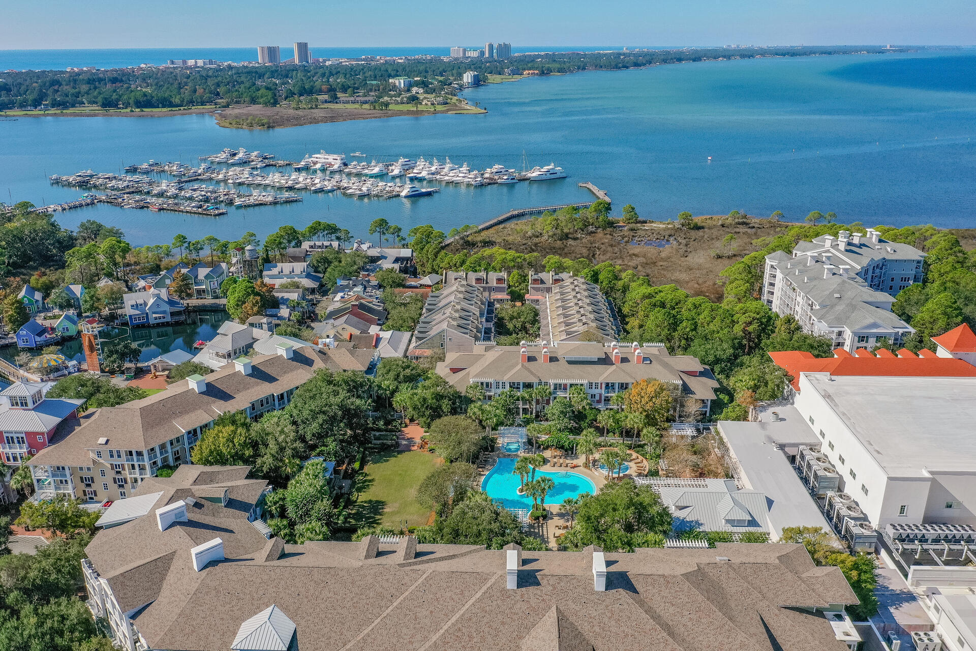 9201 Market Street Inn, Unit 162 Miramar Beach, FL 32550 - Photo 58 of 67 an aerial view of a city with lots of residential buildings ocean and mountain view in back