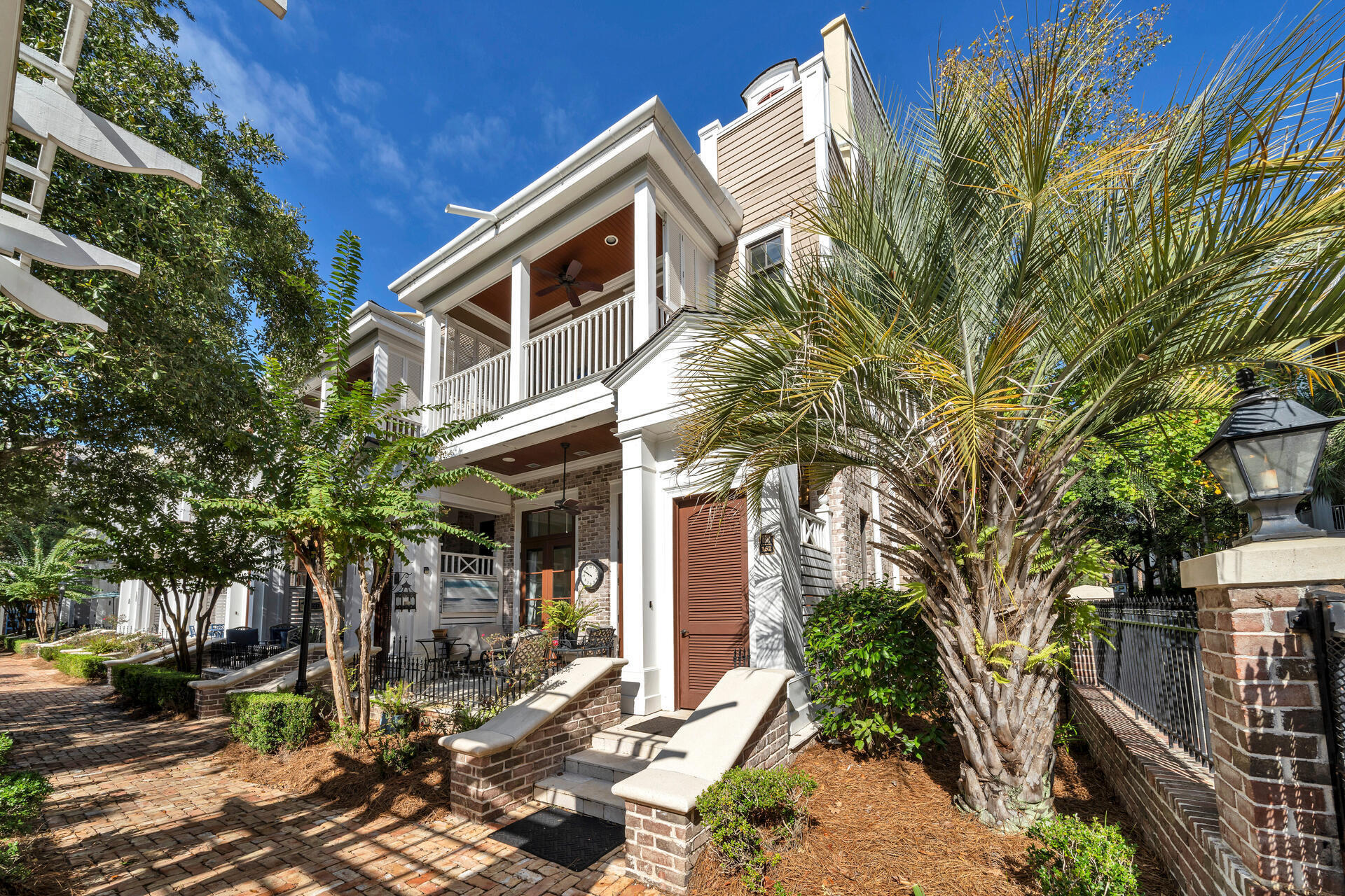 9201 Market Street Inn, Unit 162 Miramar Beach, FL 32550 - Photo 7 of 67 a front view of a house with garden