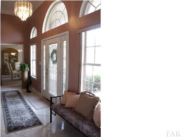 2585 Crescent Road Navarre, FL 32566 - Photo 2 of 7 a living room with furniture and a large window