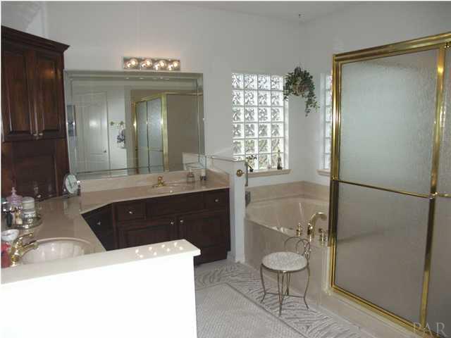 2585 Crescent Road Navarre, FL 32566 - Photo 6 of 7 a bathroom with a sink a toilet and shower