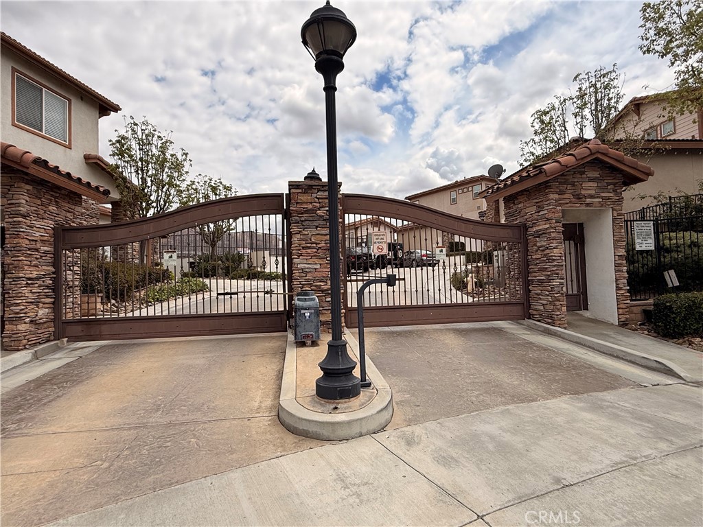 585 Vía Pueblo Riverside, CA 92507 - Photo 2 of 2 a front view of a building with parking space and garage