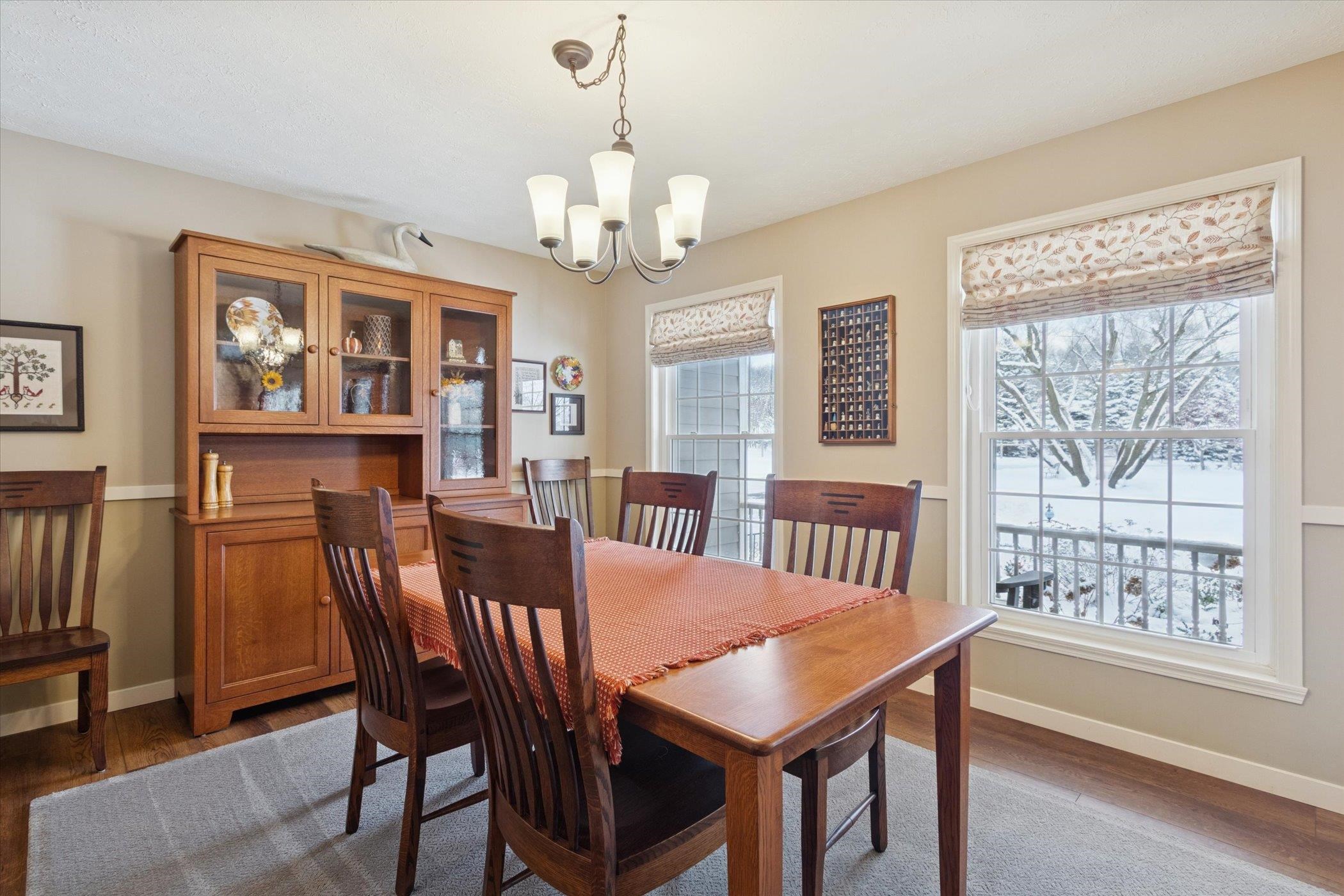 10906 Hamborg Road Roscoe, IL 61073 - Photo 11 of 65 a view of a dining room with furniture large window and wooden floor