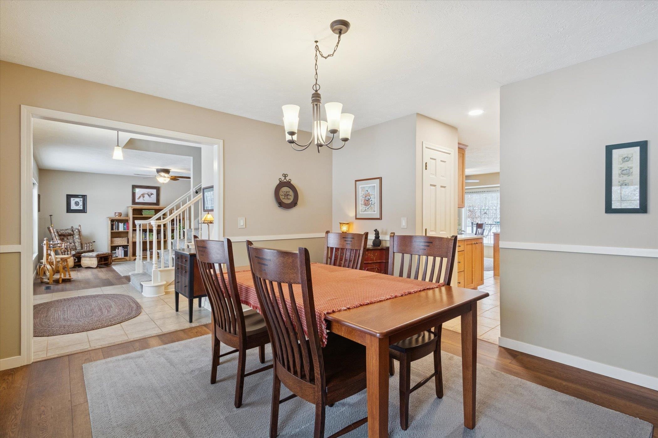 10906 Hamborg Road Roscoe, IL 61073 - Photo 12 of 65 a view of a dining room with furniture and wooden floor